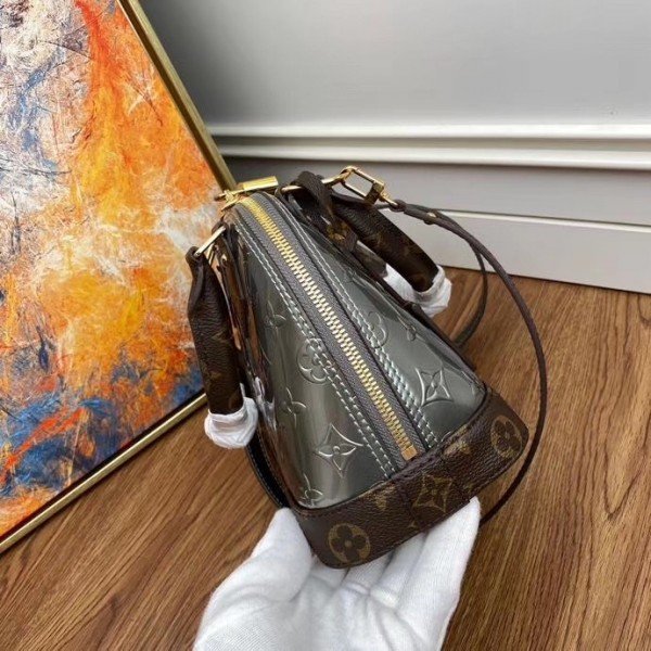 Louis Vuitton Alma Handbag Metallic Monogram Vernis with Leather
